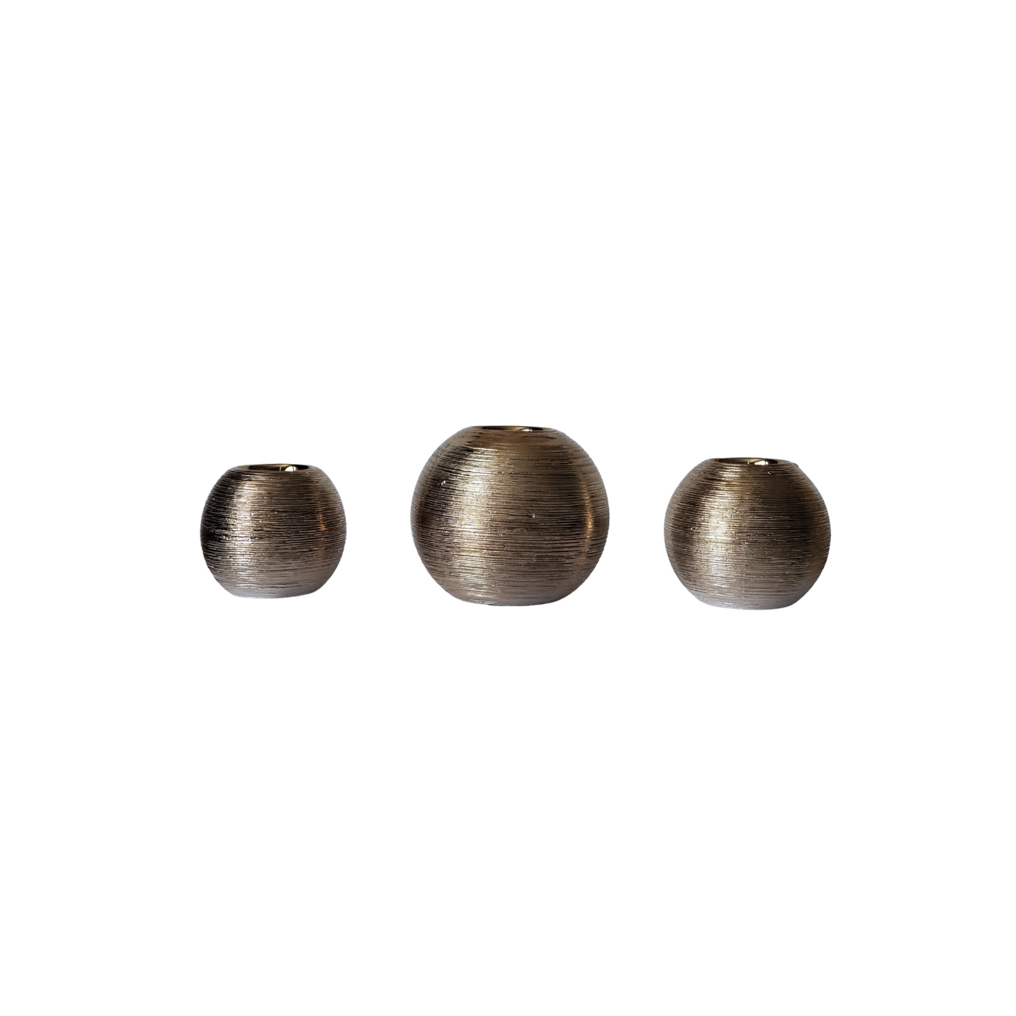 Cognac colored tea light candle holders. These spun round tea light holders are graduating in size, 3 in set