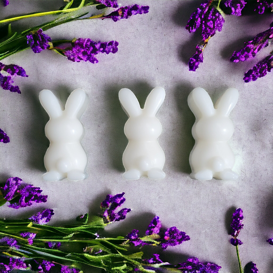 3 white bunny soy wax melts with lavender flowers in the background 