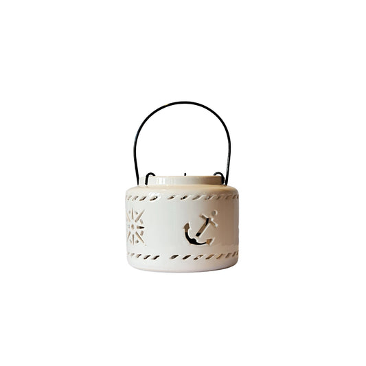 White nautical lantern, lanterns are uniquely designed with nautical shaped cut outs that allow light from the candles to shine through.  Each lantern has a wire insert that holds the candle in the middle of the lantern and metal handle for hanging 