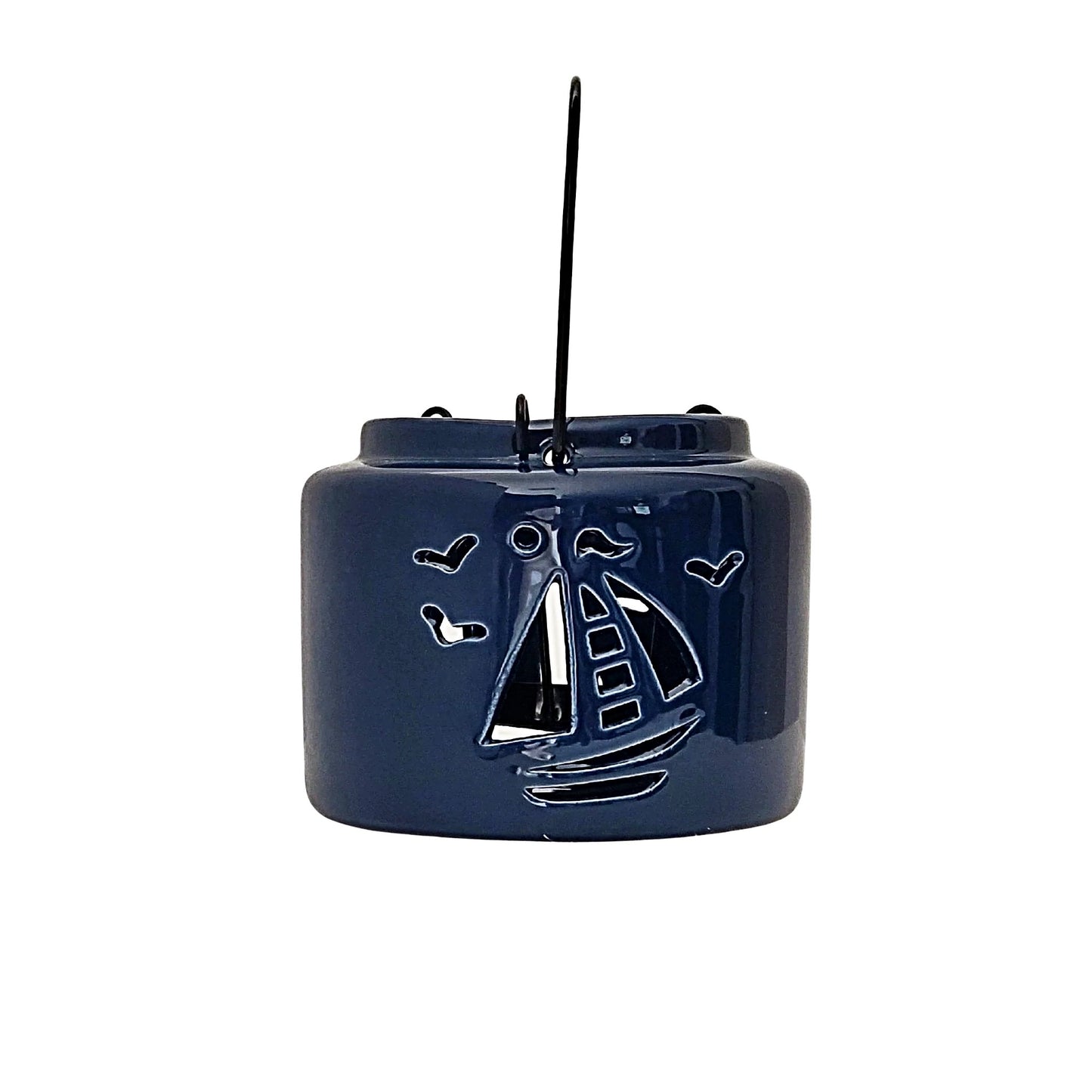 Navy blue nautical lantern, These lanterns are uniquely designed with nautical shaped cut outs that allow light from the candles to shine through.  Each lantern has a wire insert that holds the candle in the middle of the lantern and metal handle for hanging 
